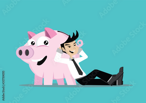 Businessman successful  smiling and relaxed at a piggy bank.