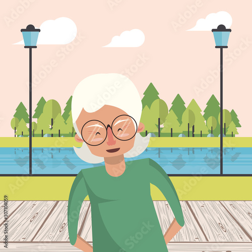 cute grandmother in the park landscape