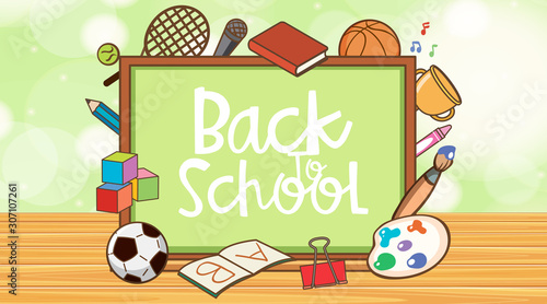 Back to school sign with board and school items photo