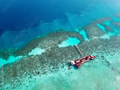 Aerial view of water chalet in Egang Egang near Bum Bum Island during sunrise. photo