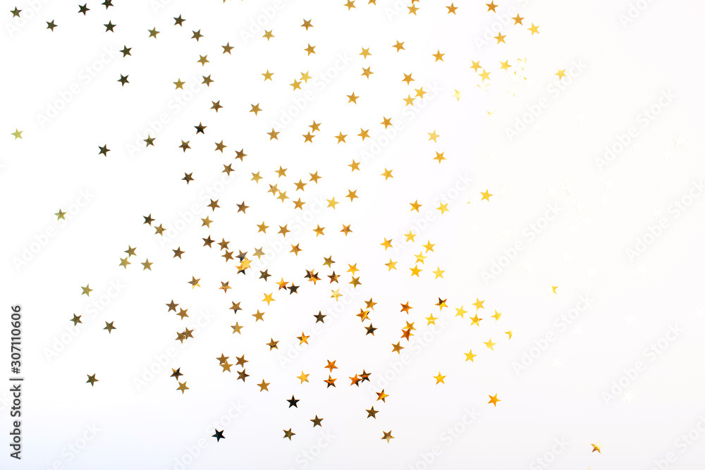 Golden stars on white background. Flat lay, top view.