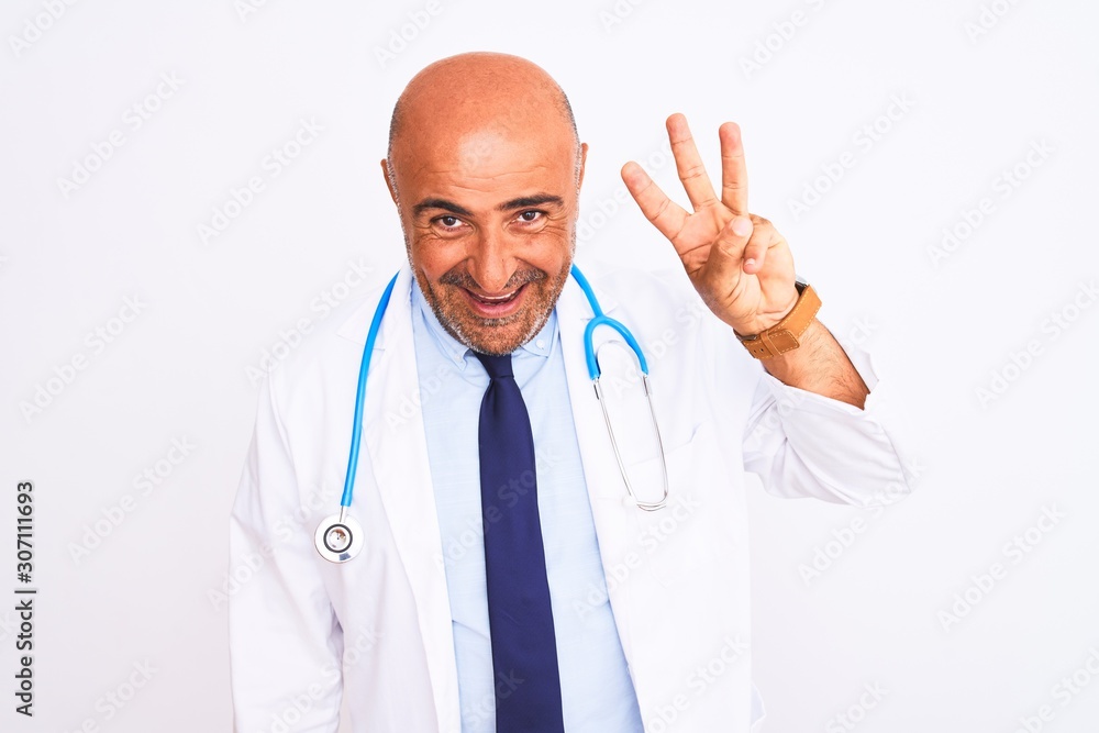 Middle age doctor man wearing stethoscope and tie standing over isolated white background showing and pointing up with fingers number three while smiling confident and happy. Middle age doctor man wearing stethoscope and tie standing over isolated white background showing and pointing up with fingers number three while smiling confident and happy.