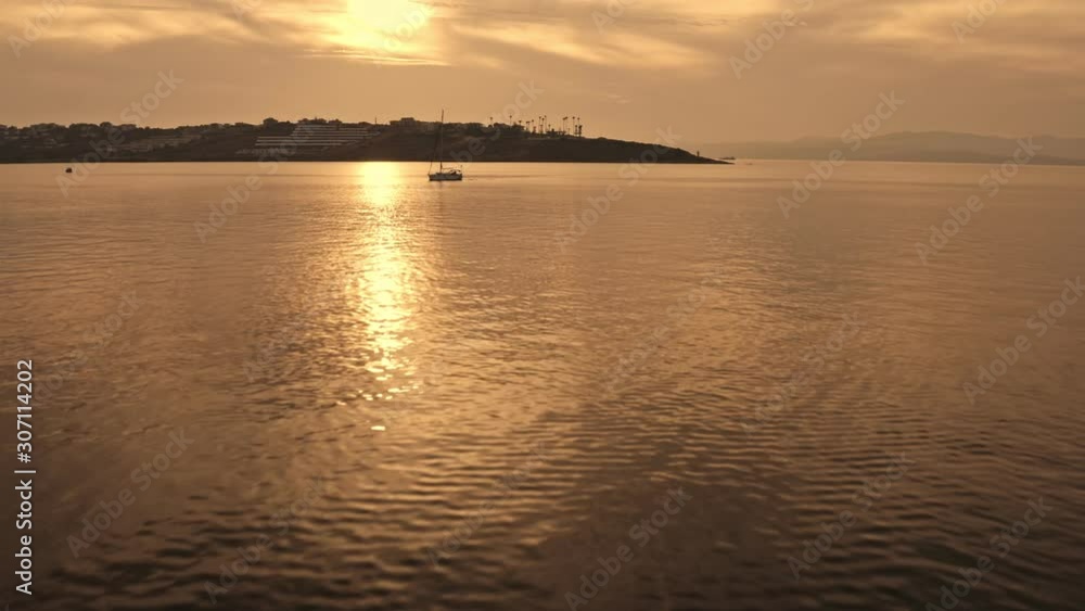 Sailing In The Sunset. This video features a sailboat during sunset, sailing in the ocean. Sailing In The Sunset. This video features a sailboat during sunset, sailing in the ocean.