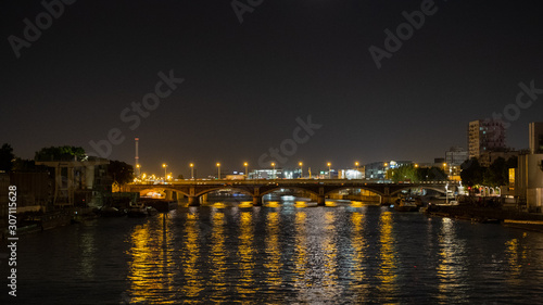 Bridge over a river at night  Seine  Paris