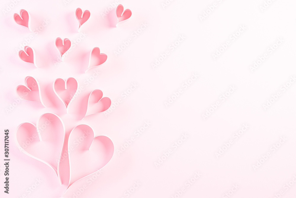 Fototapeta Pink paper hearts on Light pink pastel paper background. Love and Valentine's day concept.