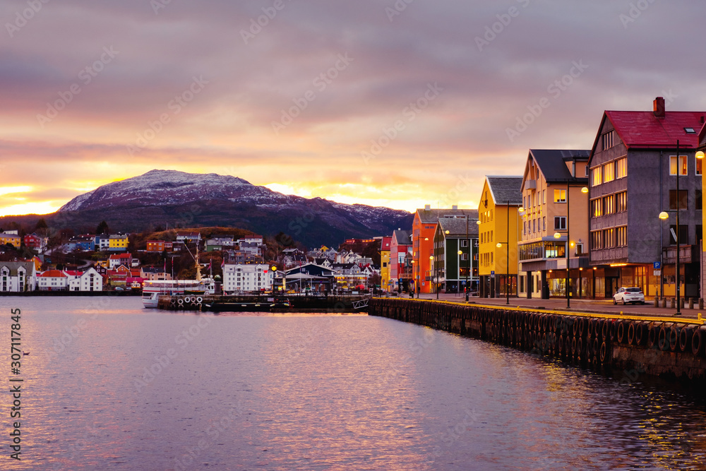 View of city center of Kristiansund, Norway during the cloudy morning at sunrise