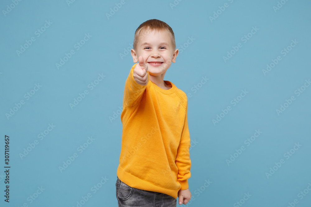 Little cute kid boy 45 years old wearing yellow clothes isolated on