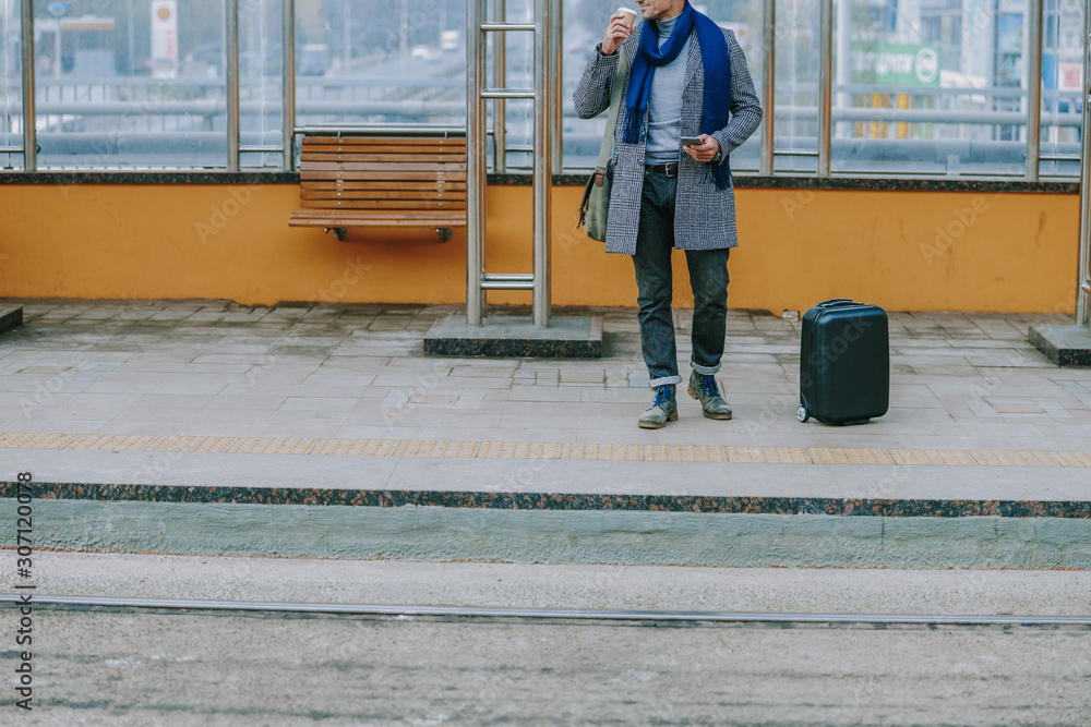 Stylish gentleman drinking coffee on the street Stylish gentleman drinking coffee on the street