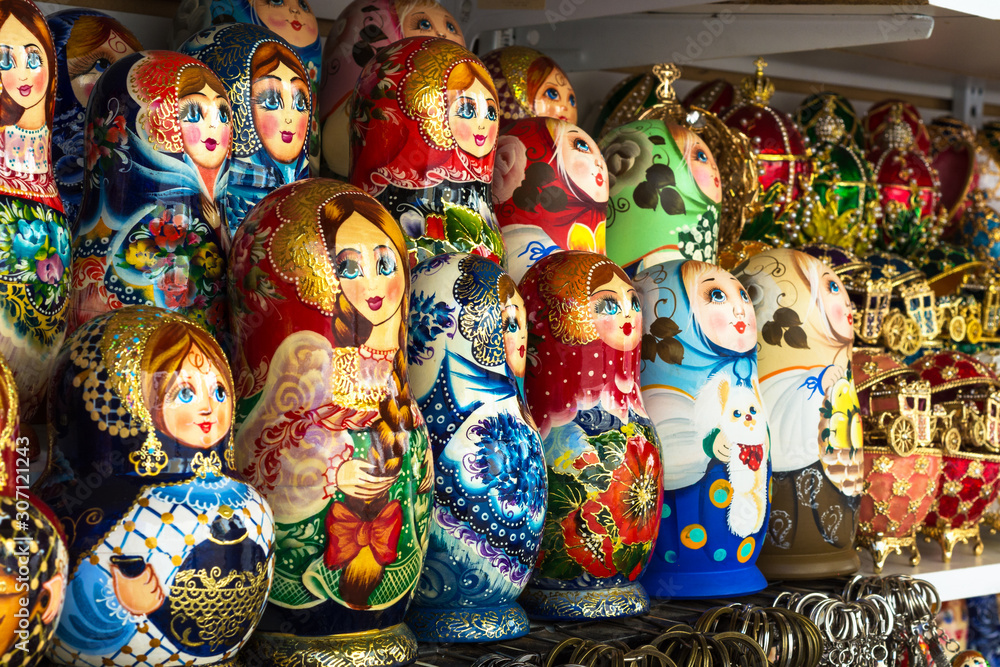 Wooden Nesting Dolls or Russian Matryoshka Dolls in the street market in Russia, nesting dolls  - traditional Russian souvenirs for tourists