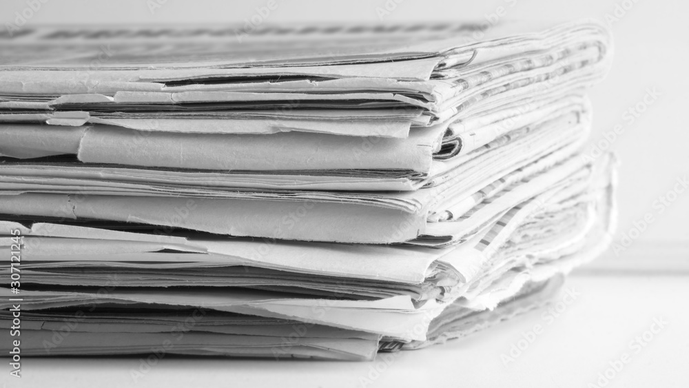 Newspaper Pages Stacked in Pile, Close up Newspaper Pages Stacked in Pile, Close up