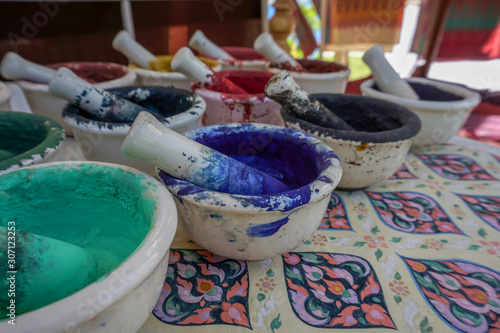Dried watercolors in small porcelain mortars © Adisorn