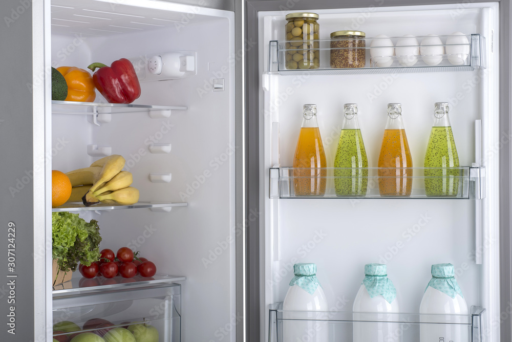 Open fridge full of fresh fruits and vegetables Open fridge full of fresh fruits and vegetables
