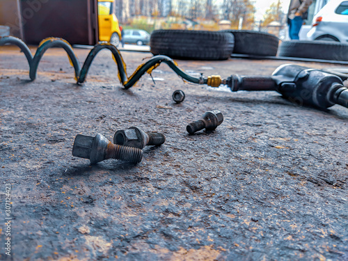 During car tires and wheels changing season, image shot at professional car mechanic shop for changing tires for safer driving in a new season photo