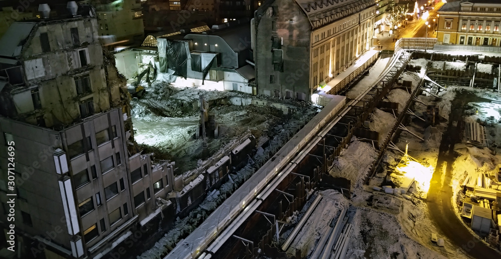 Construction site at night. Demolished building and excavated market square in Turku, Finland.