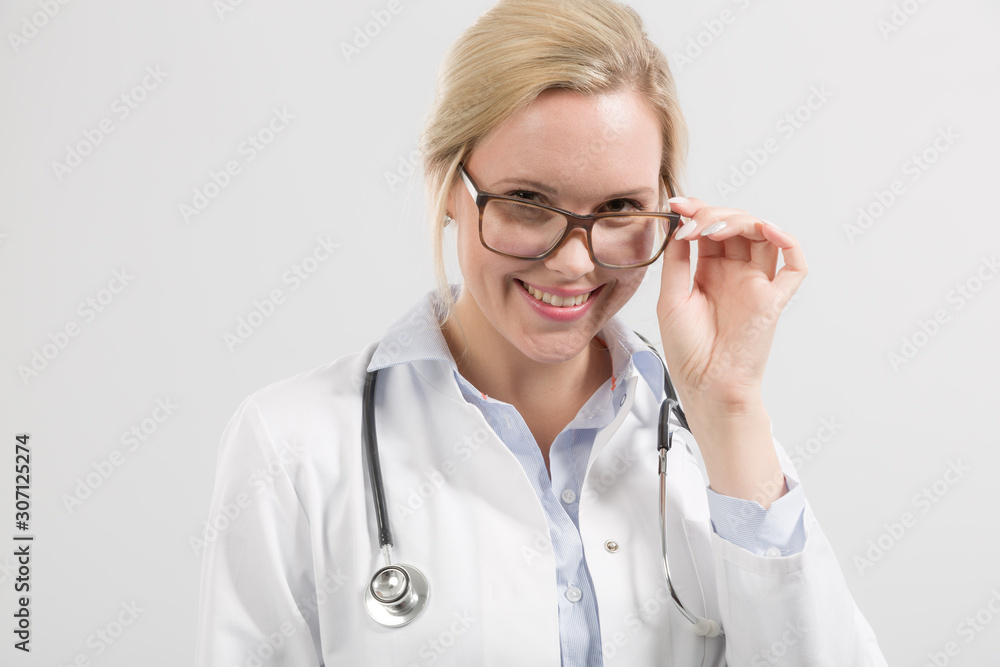 frienly looking female family doctor in doctor's overall with stethoscope frienly looking female family doctor in doctor's overall with stethoscope
