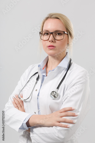 portrait of young female family doctor in doctor's overall with stethoscope