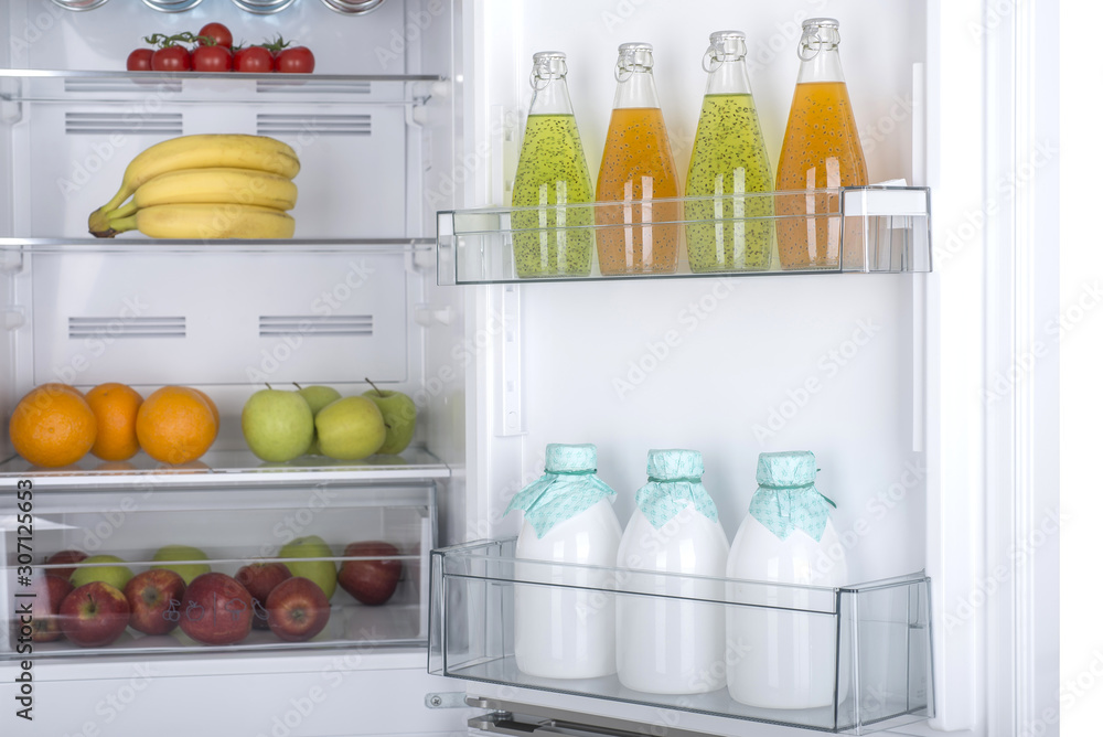 Open fridge full of fresh fruits and vegetables Open fridge full of fresh fruits and vegetables