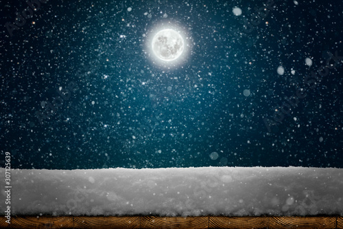 a winter Christmas background with snow on the wood