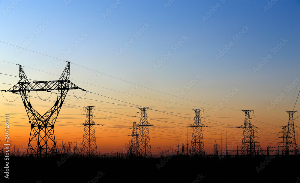 High voltage tower, silhouetted in the evening