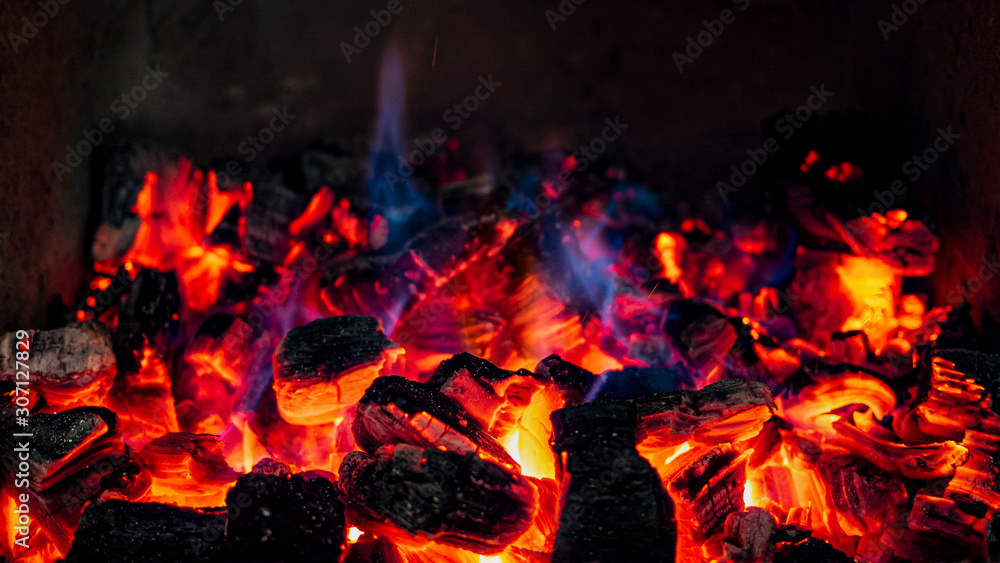 Red Hot Embers, burning with blue extremely hot flames Red Hot Embers, burning with blue extremely hot flames