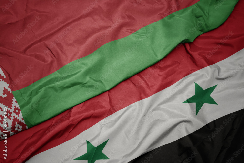 waving colorful flag of syria and national flag of belarus.