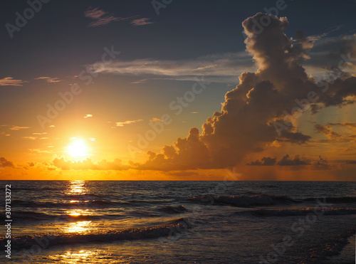 Obraz na plátně Bright Sunset and Isolated Rain Storm Over Gulf of Mexico