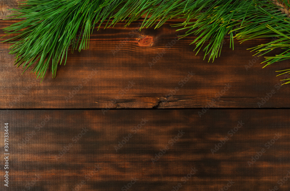 Christmas tree branch on wooden table. Christmas, New Year and Winter holiday concept photo. Christmas tree branch on wooden table. Christmas, New Year and Winter holiday concept photo.