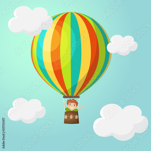 Happy boy in a striped multicolor hot air balloon in the sky with clouds. Vector illustration, poster, greeting card in cartoon style