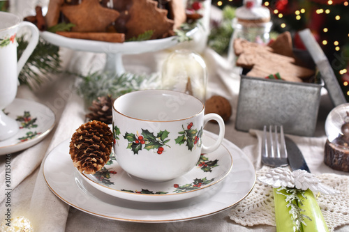 Christmas table setting with traditional porcelain tableware set