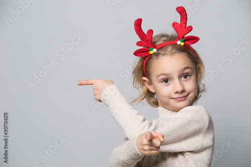 Little girl in winter look. Christmas concept.