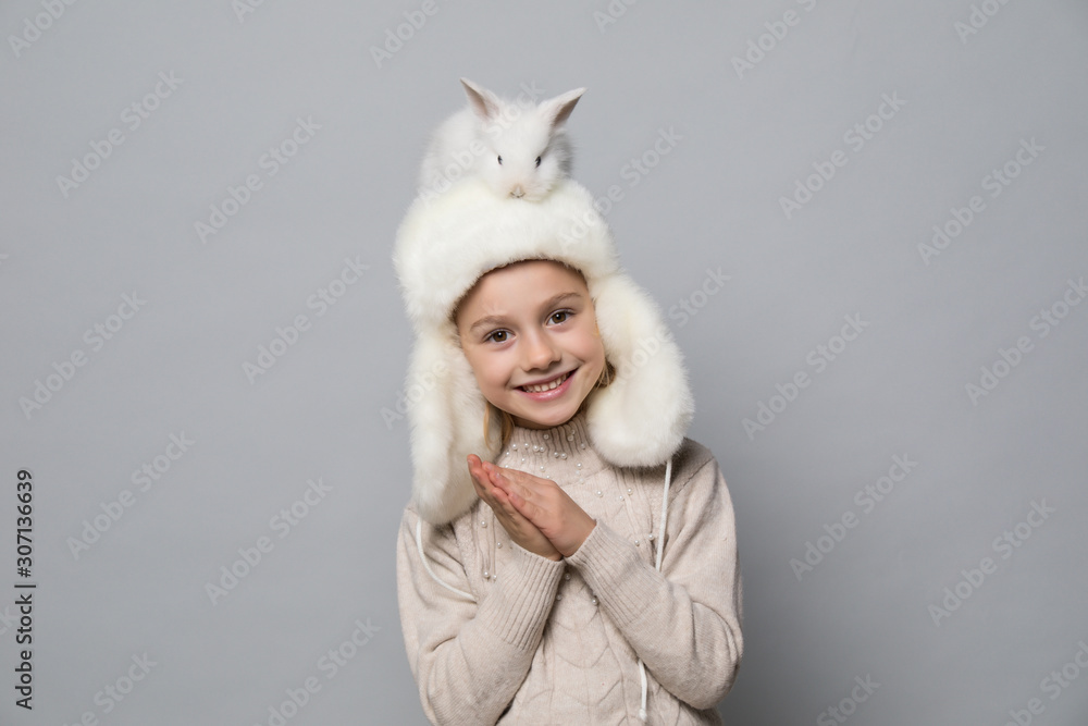 Obraz premium Little girl in winter look. Christmas concept.