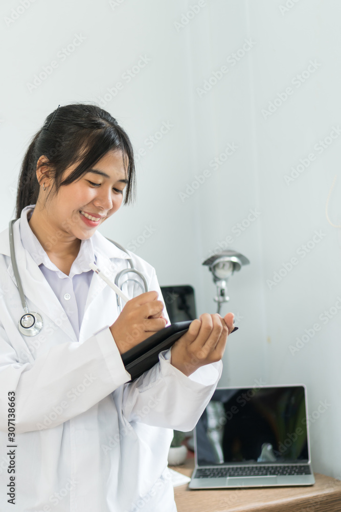 Asian doctor or Female student medicine holding tablet with prescription medical record patient, post for advertising practitioner in white uniform, Technology treatment healthcare at hospital concept Asian doctor or Female student medicine holding tablet with prescription medical record patient, post for advertising practitioner in white uniform, Technology treatment healthcare at hospital concept