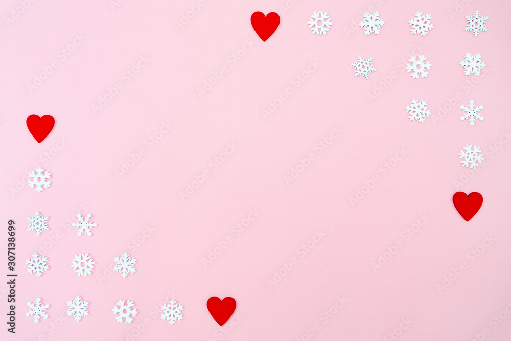 Valentine's Day background. red hearts and snowflakes on pink background. Valentines day concept. Flat lay, top view, copy space
