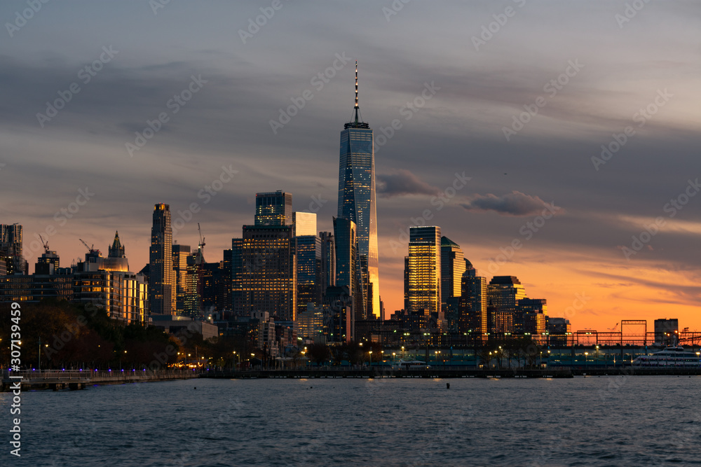 Skyline of the New York City Financial District along the Hudson River during a Sunset
