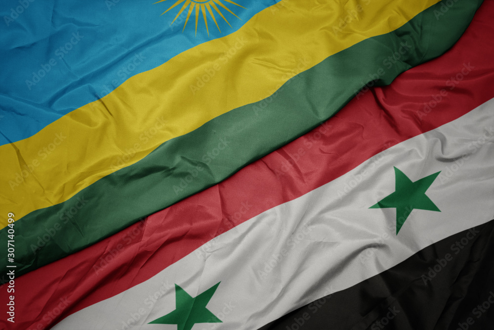 waving colorful flag of syria and national flag of rwanda.