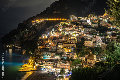 Colorful houses of Positano along Amalfi coast at night, Italy. Night landscape.