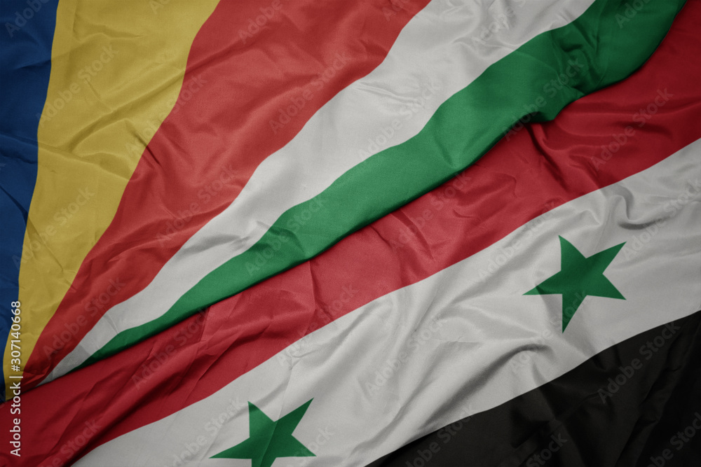 waving colorful flag of syria and national flag of seychelles.