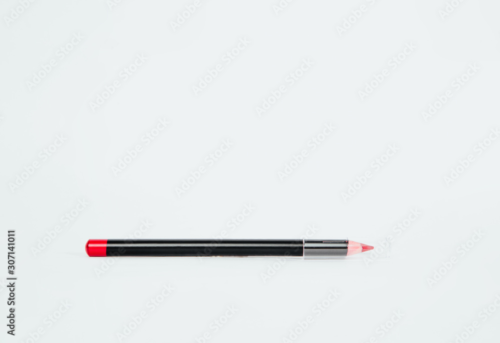 Eye pencil on a bright white background. Fashion and beauty concept. Taking care of yourself, embellishing with cosmetics, women. Eye pencil on a bright white background. Fashion and beauty concept. Taking care of yourself, embellishing with cosmetics, women.