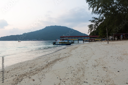 Boat parked near jetty with no people at Perhentian islands in Terengganu in Malaysia photo