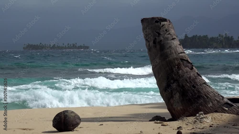 Rough Caribbean Sea and Waves on Empty Sandy Beach on San Blas Island, Panama Rough Caribbean Sea and Waves on Empty Sandy Beach on San Blas Island, Panama