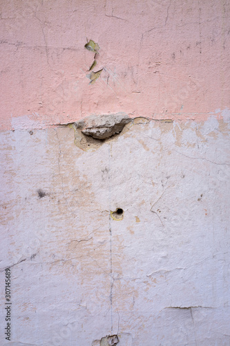 cracked and peeling paint and grunge old wall with texture © Maciej