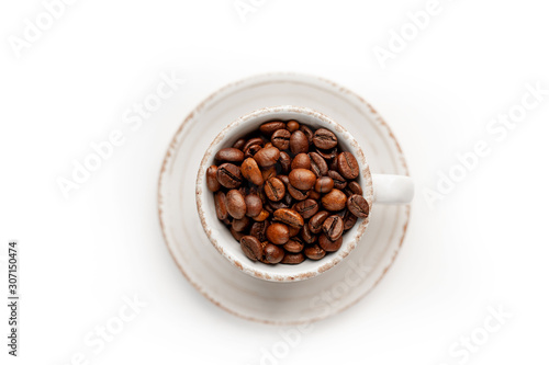 Cup of coffee with fried beans on white  background, isolate