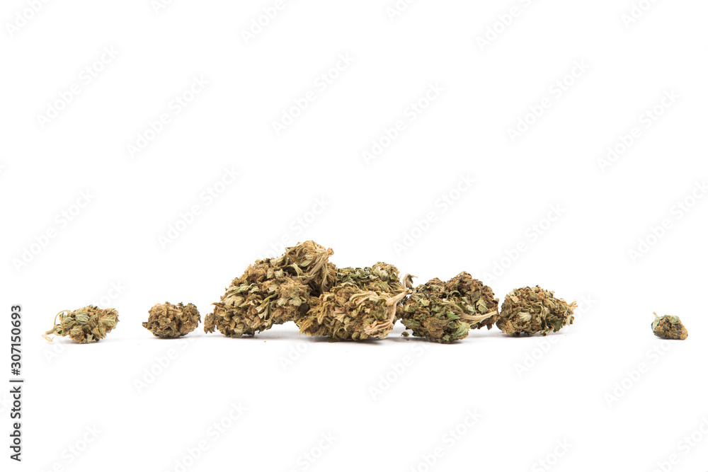 Macro of dried bud of marijuana of different sizes , isolated on white background. Dry cannabis. Copy space Macro of dried bud of marijuana of different sizes , isolated on white background. Dry cannabis. Copy space