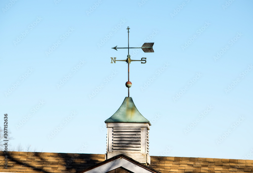 Foto de A WEATHER VANE made as an arrow with directional points