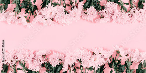 Beautiful flowers composition. Pink flowers on pink background. Valentines Day, Easter, Happy Women's Day, Mother's day. Flat lay, top view, copy space, banner photo