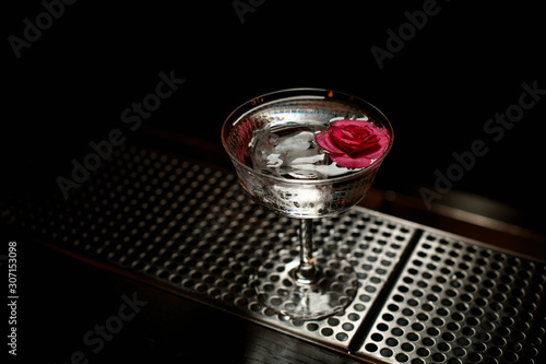 Alcohol drink decorated with a pink flower