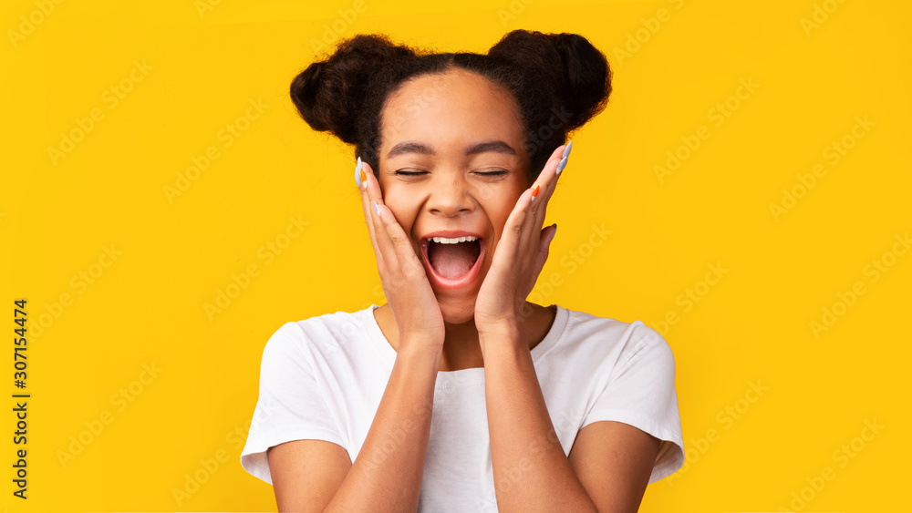 Happy black girl screaming and holding cheeks Happy black girl screaming and holding cheeks
