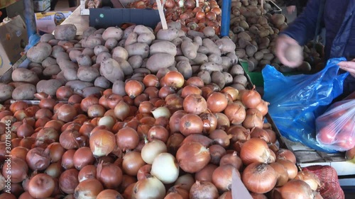 Potatoes and onions raw food in the market place