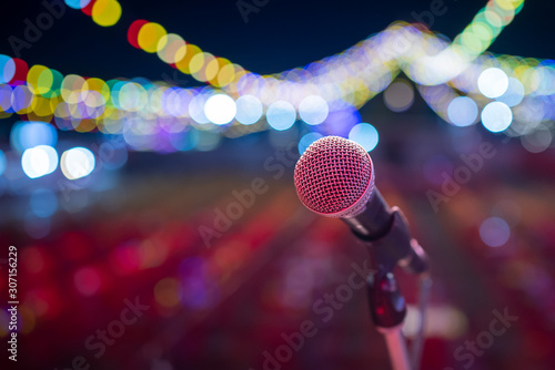 Close-up of a microphone in the concert hall Stage microphone with colorful lights