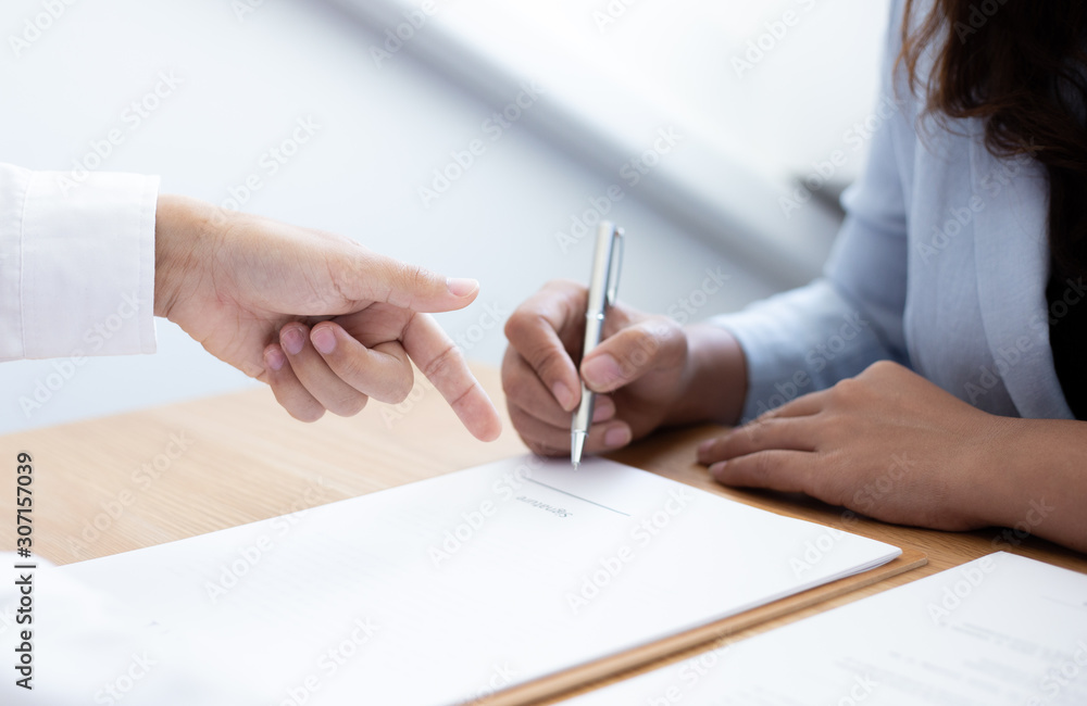 Business people negotiate for customers to sign land sales contracts, Property purchase contract of concept.. Business people negotiate for customers to sign land sales contracts, Property purchase contract of concept..